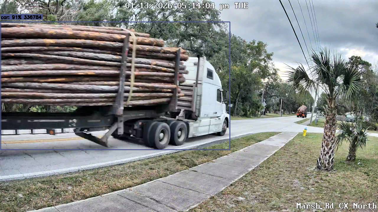 Fully loaded logging truck filling entire lane on Marsh Road